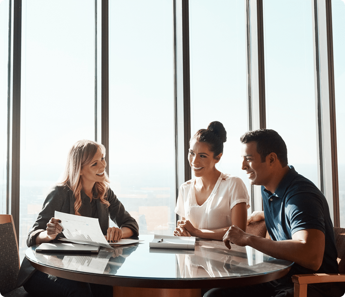 Shot of a young couple meeting with a financial planner in a modern office